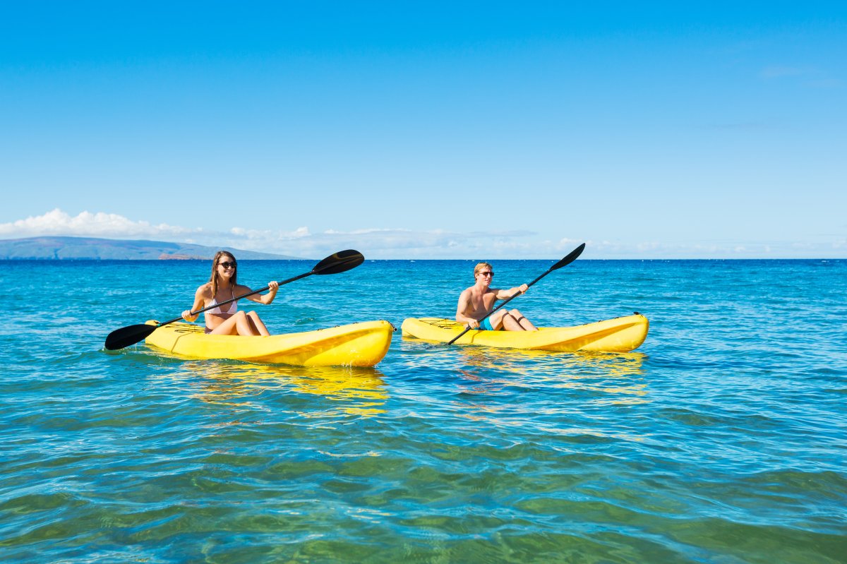 Two people kayaking off Maui 