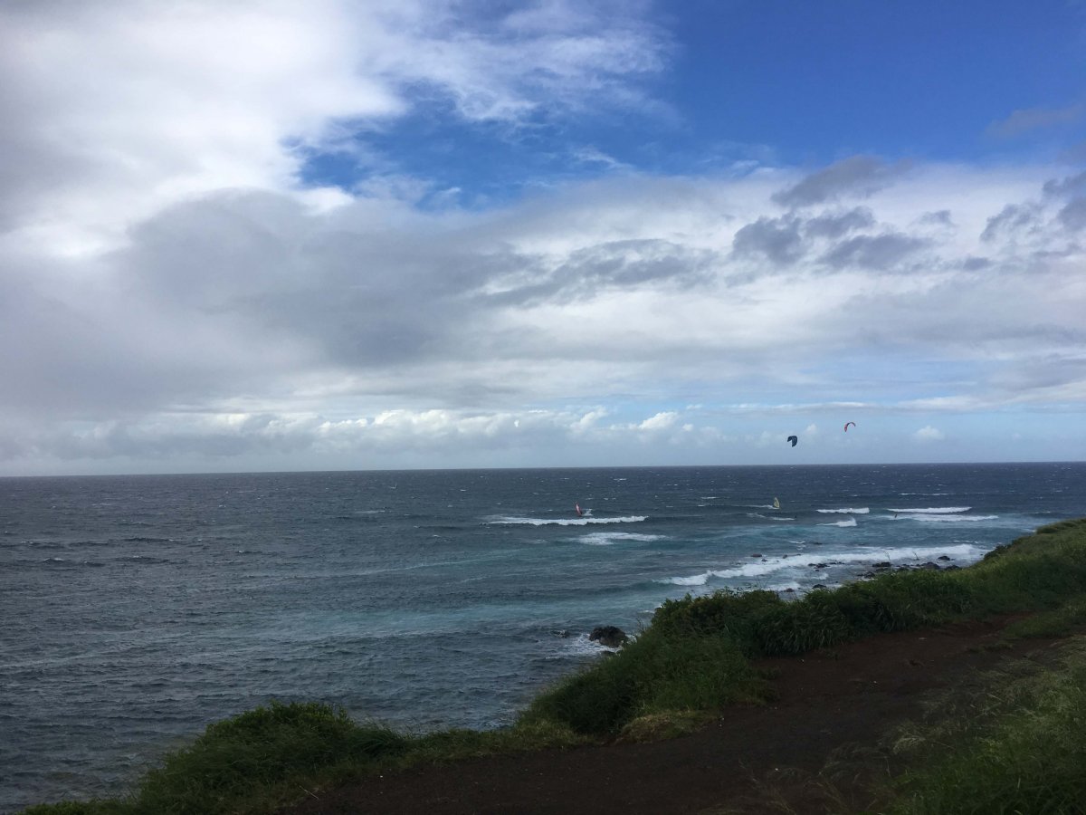 View from bluffs of kite boarders and windsurfers at Hookipa on Maui's North Shore