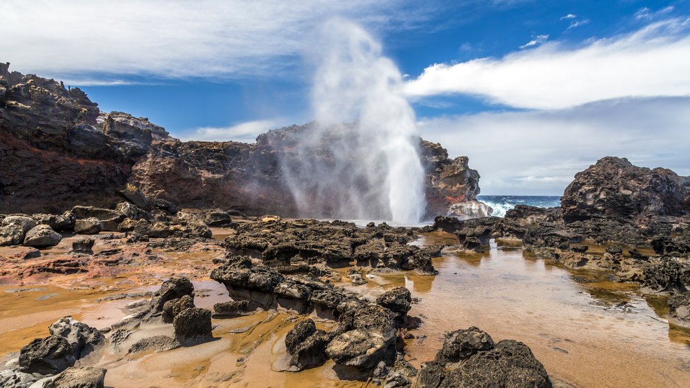 Nakalele point on the island of Maui, Hawaii. famous for a blowhole which produces powerful geyser-like water spouts with heights of up to 100 feet generated with the waves and tides