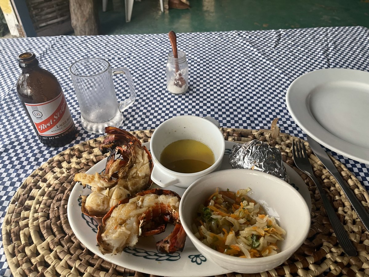 Lobster dinner with a Red Stripe at the Lobster Pot restaurant near the Round Hill Resort in Jamaica