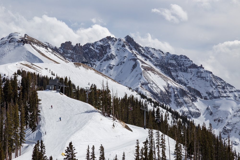 View of skiers on the mountain in Telluride, Colorado