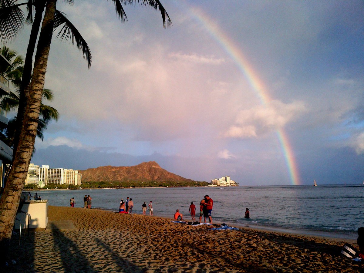 View of rainbow in Waikiki with Diamond Head in the distance