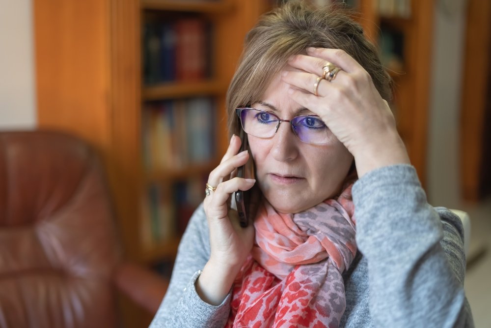 Woman on phone regarding insurance.