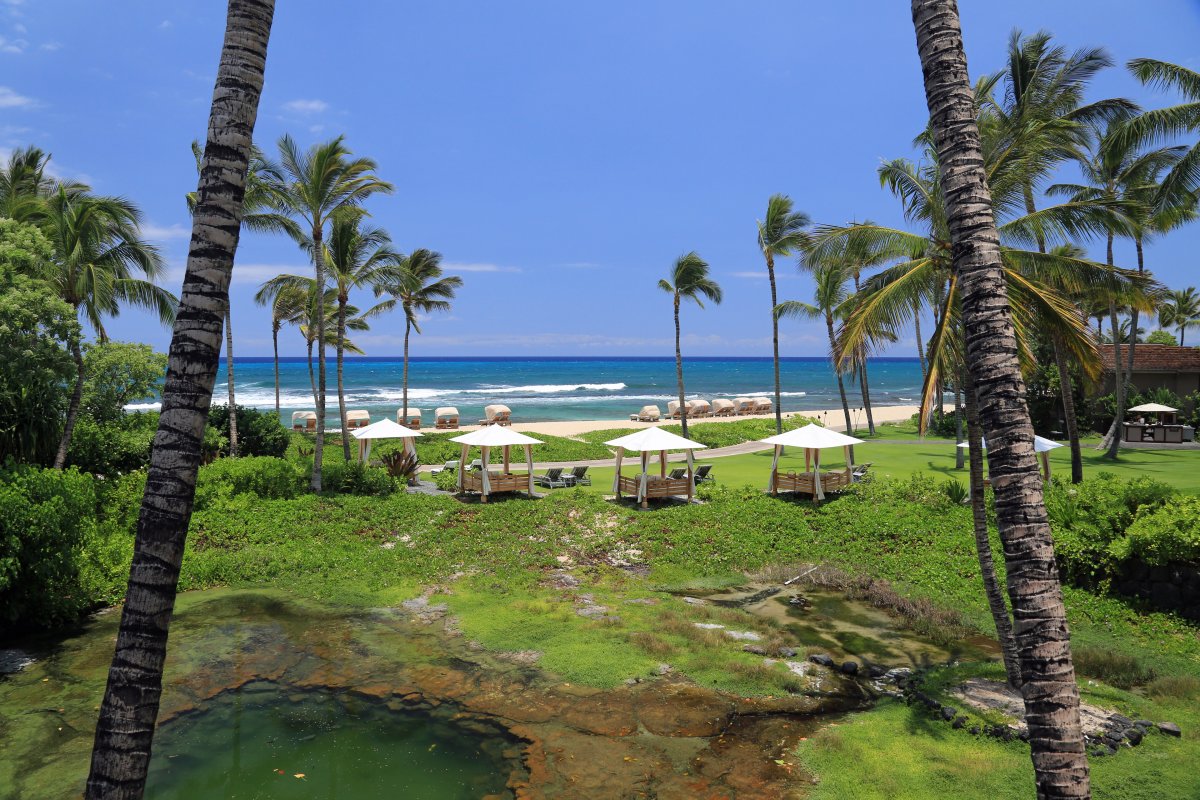 View of beachfront cabanas at the Hualalai Resort on the Big Island