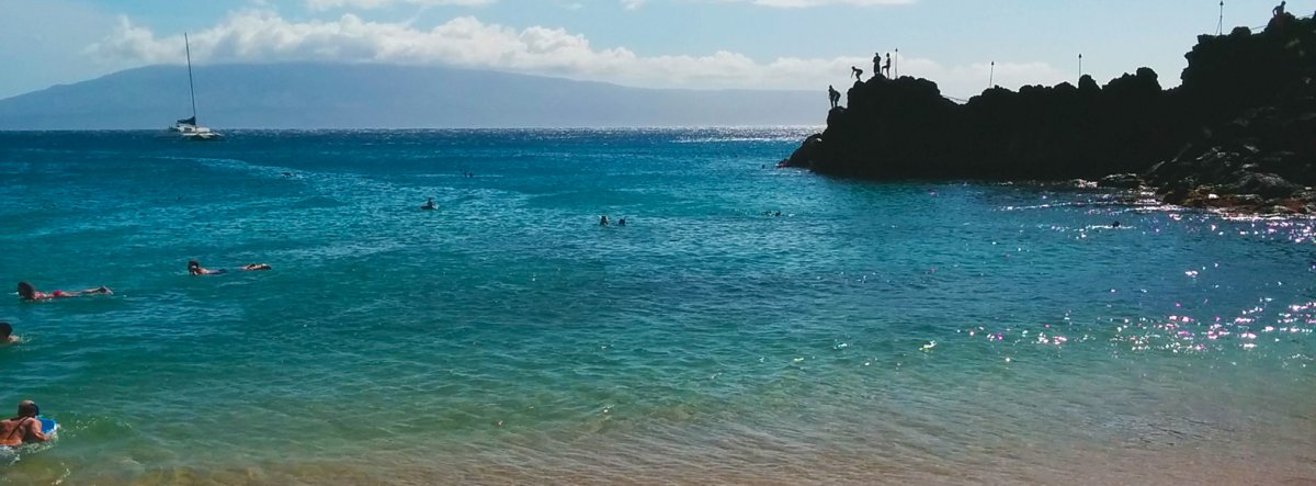 View of snorkelers at Black Rock in Kaanapali Beach in West Maui 