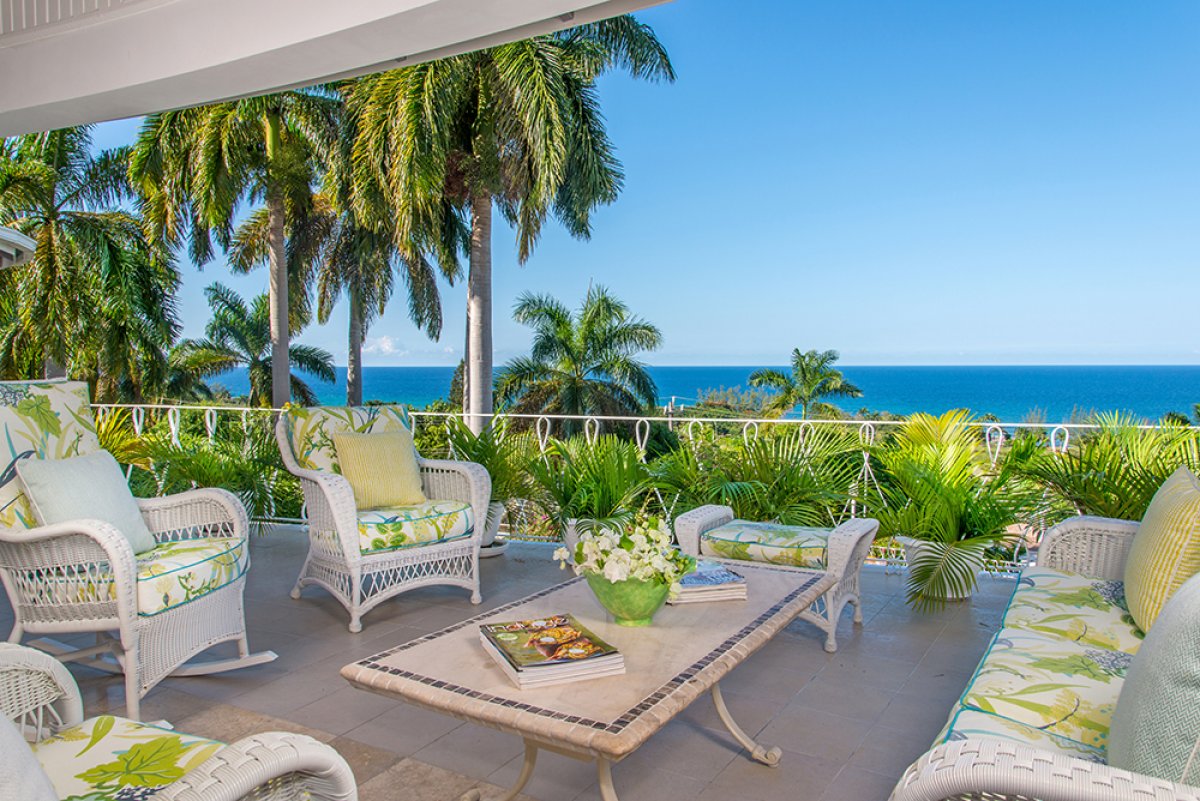 Everyone's favorite gathering place is the comfy verandah with rocking chairs ...