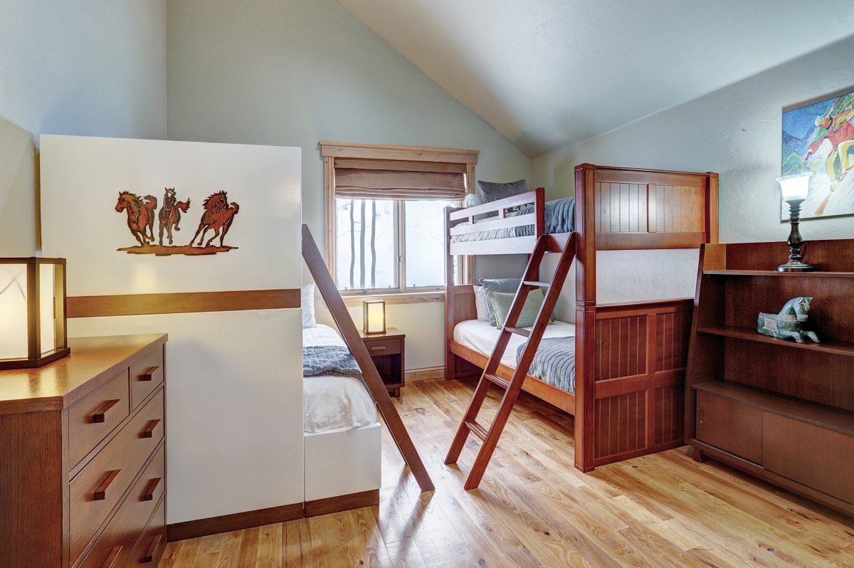 Upper level bunk room with Twin over Queen + Twin trundle and Twin over Twin bed