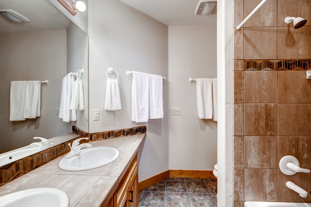 Private queen bathroom with shower/tub combo - Dunkin Hill Lodge Breckenridge Vacation Rental