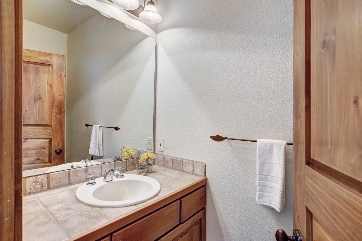 Half bathroom located on main level - Amber Sky Breckenridge Vacation Rental