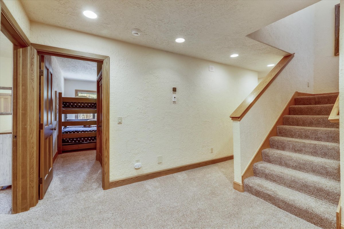 Downstairs view with additional bedrooms - Evergreen Lodge Breckenridge Vacation Rental