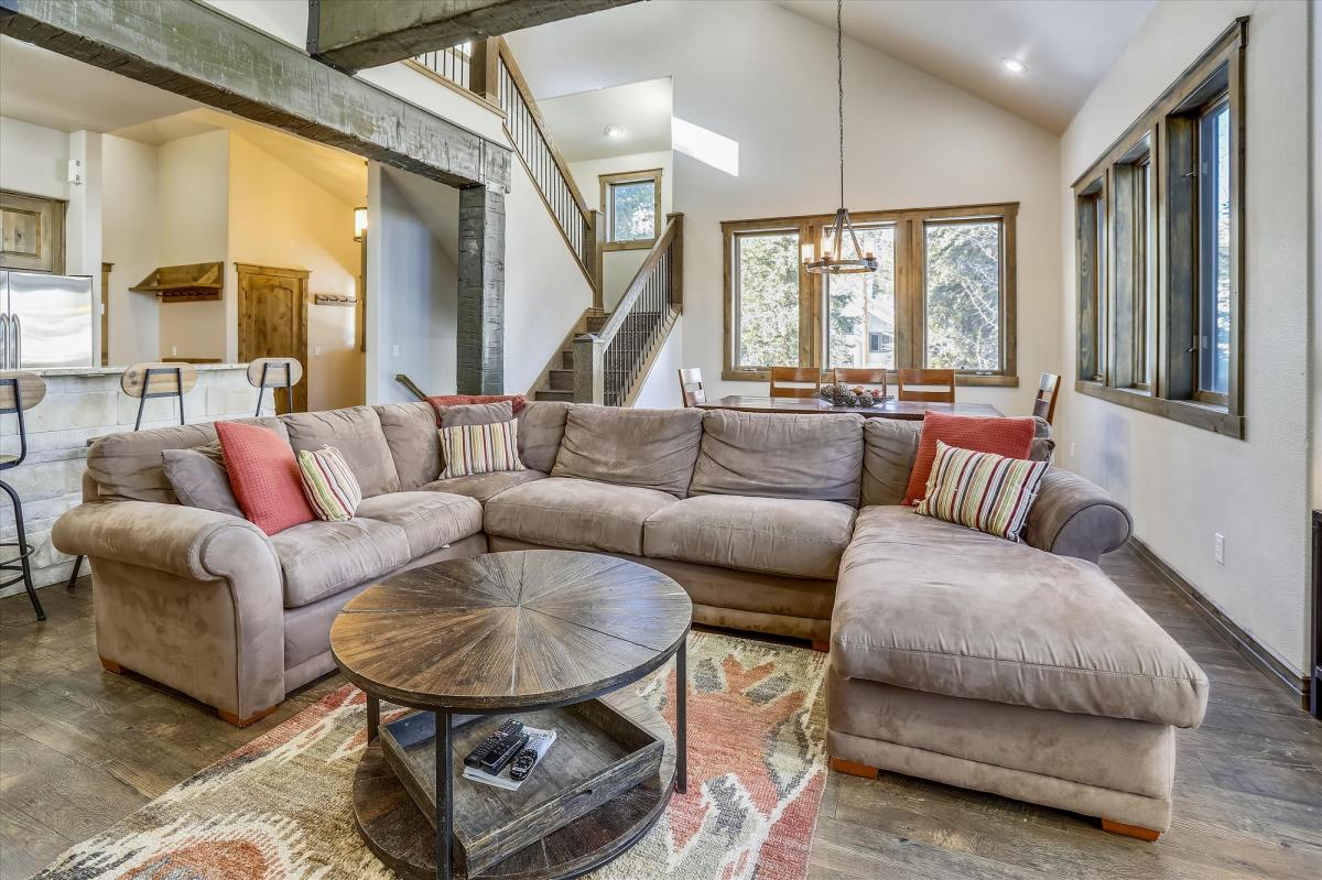 Cozy living area with ample natural light - Highwood Hideaway Breckenridge Vacation Rental