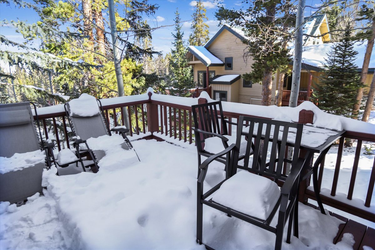 Main level deck with sun chairs and table set - Highwood Hideaway Breckenridge Vacation Rental