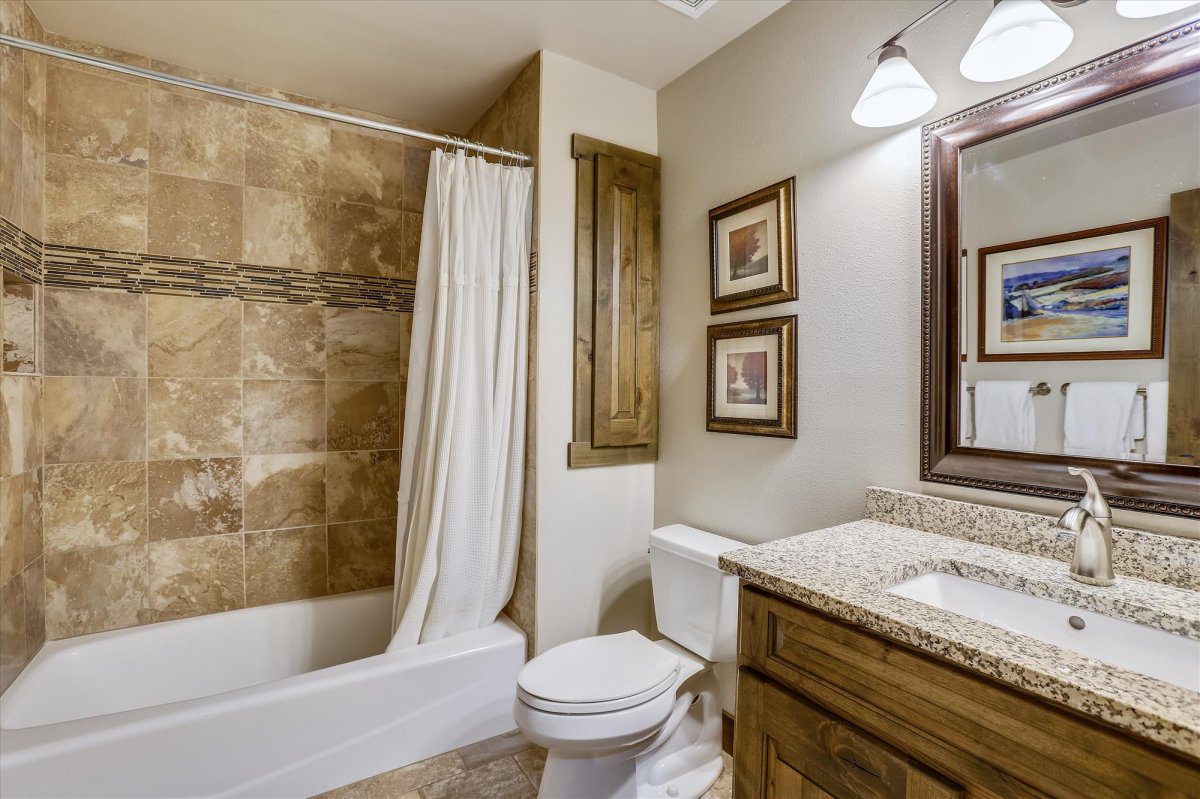 Lower level shared bathroom for both bunk rooms - Highwood Hideaway Breckenridge Vacation Rental