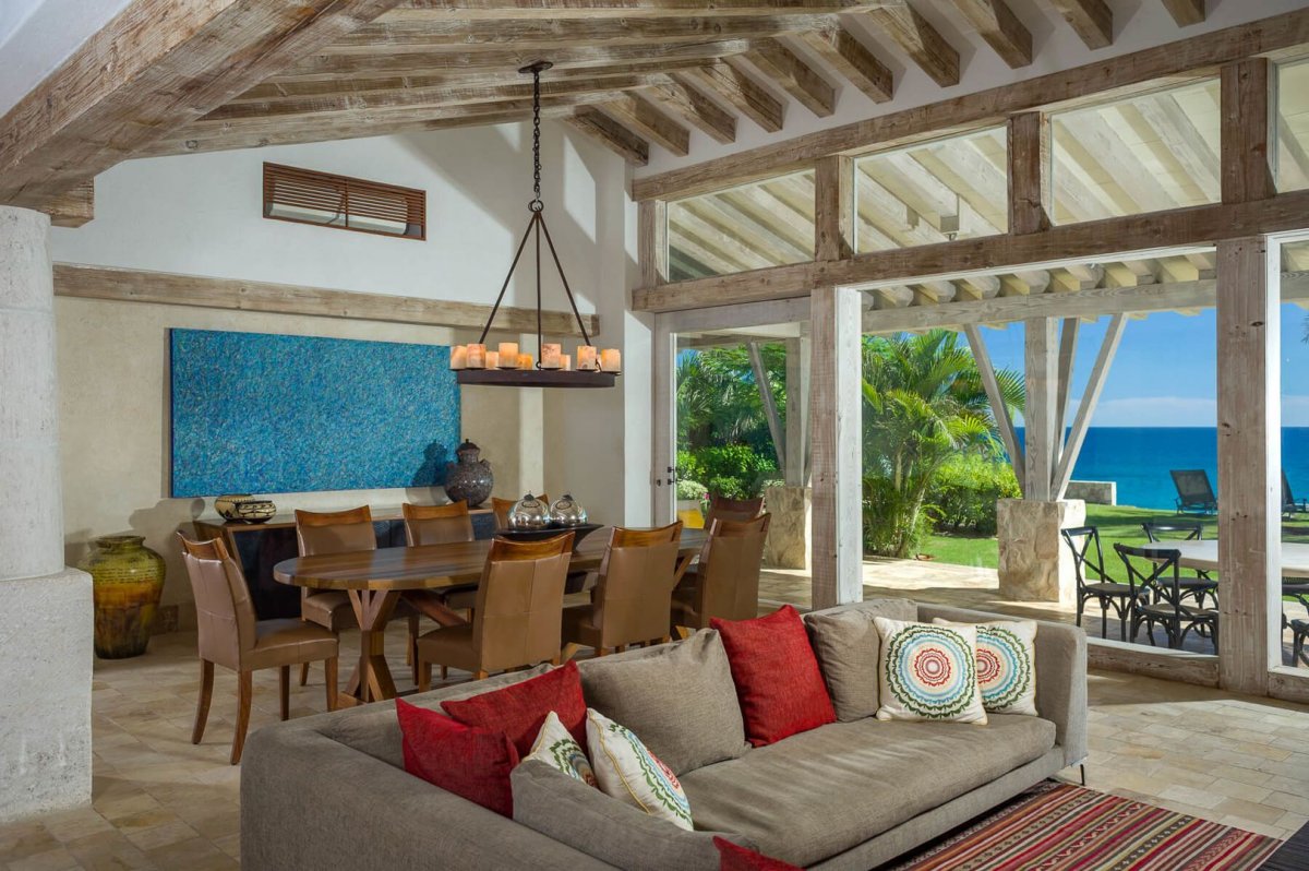 Wide windows and doors allow the bright Cabo sun to fill every corning of the open concept living and dining area.