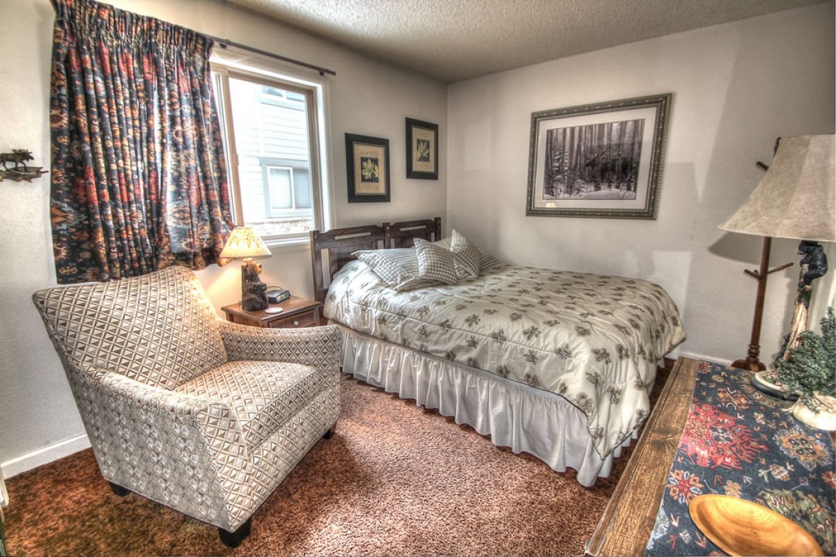 Main level second bedroom with Queen-size bed and shared bath