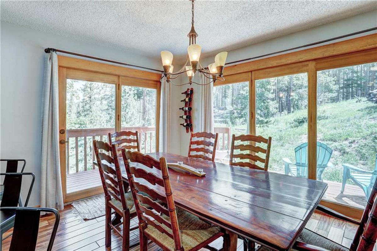 Seating for 6 at the dining room table with 6 at the kitchen bar.