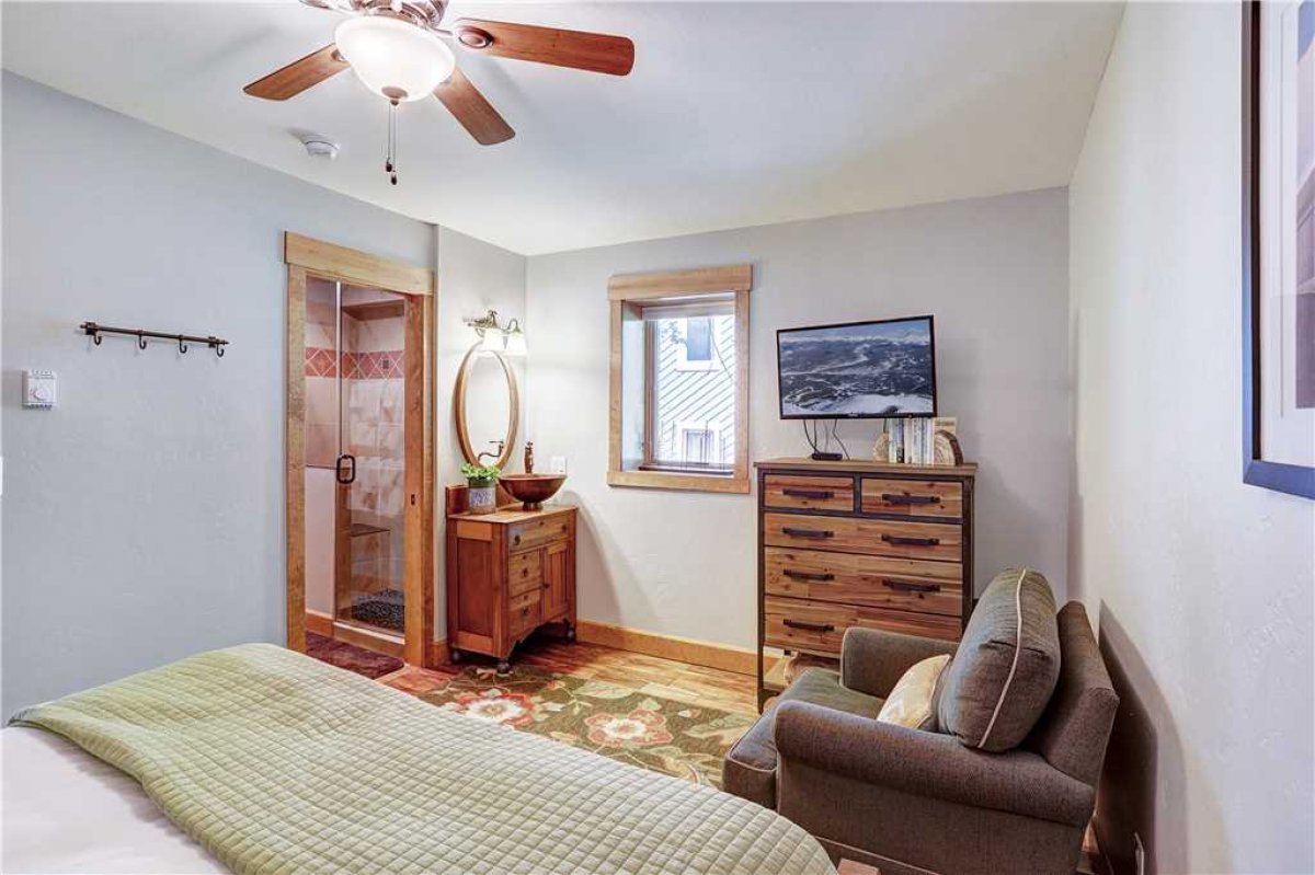 Lower level queen bedroom with Jack and Jill bathroom shared with bunk room.