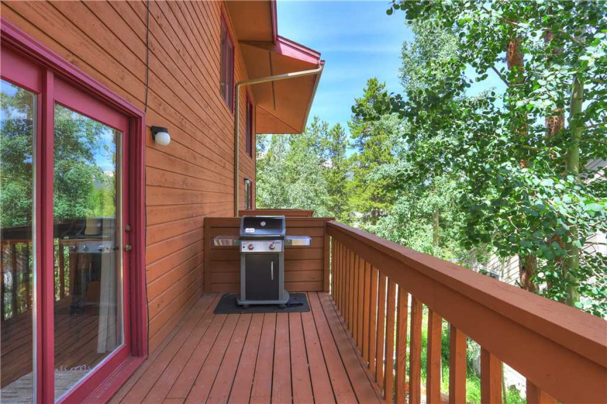 Gas grill on the deck off of the kitchen.