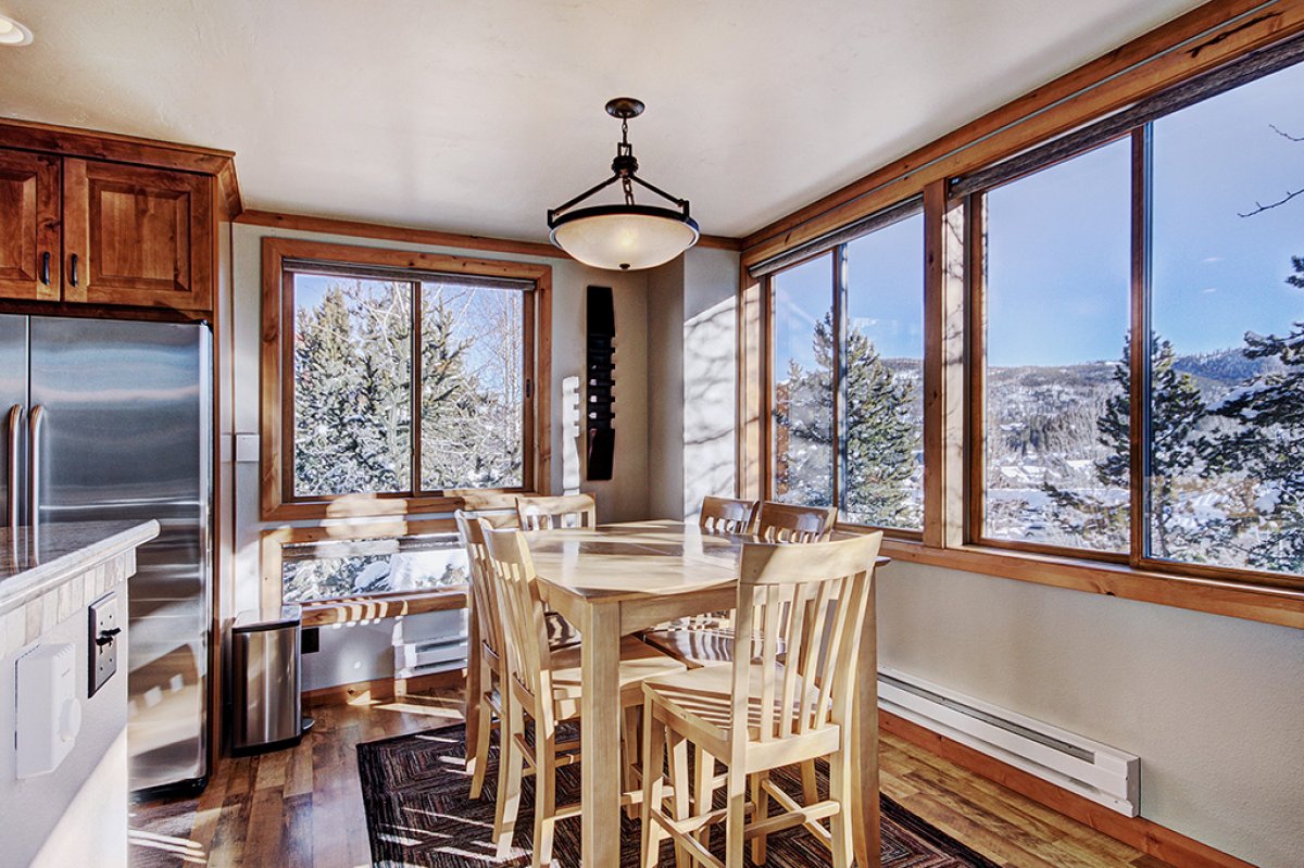 Sunny dining area for 6 allows you to take in the mountain and town views.