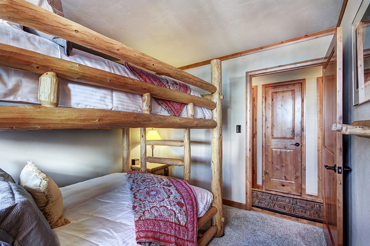 View from bunk room into hall and shared bathroom.