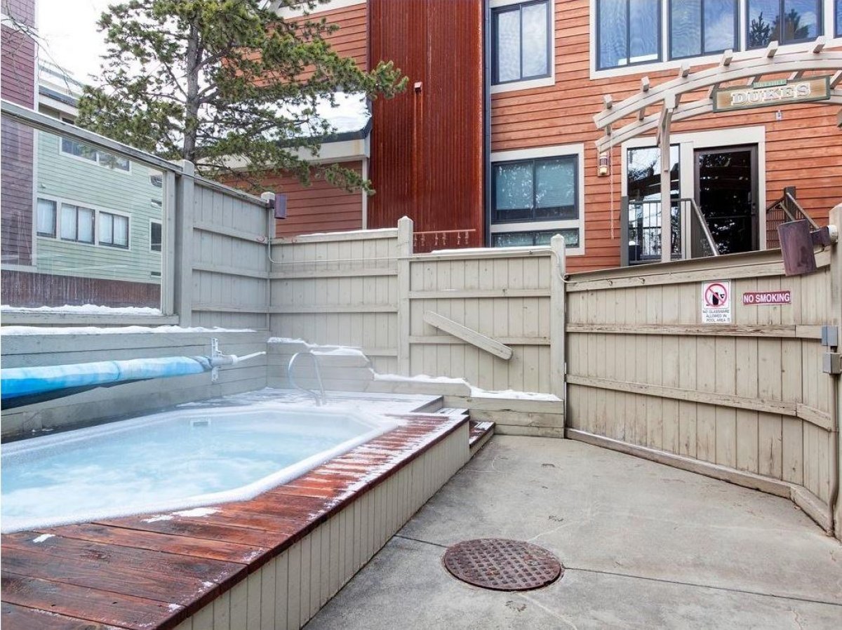 Outdoor hot tub in common area. The pool is open during the summer months.