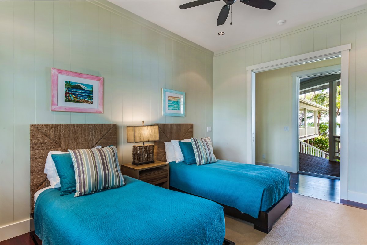Bedroom 3 with Two Twin Beds and Ocean View from Double Pocket Doors to Hallway.