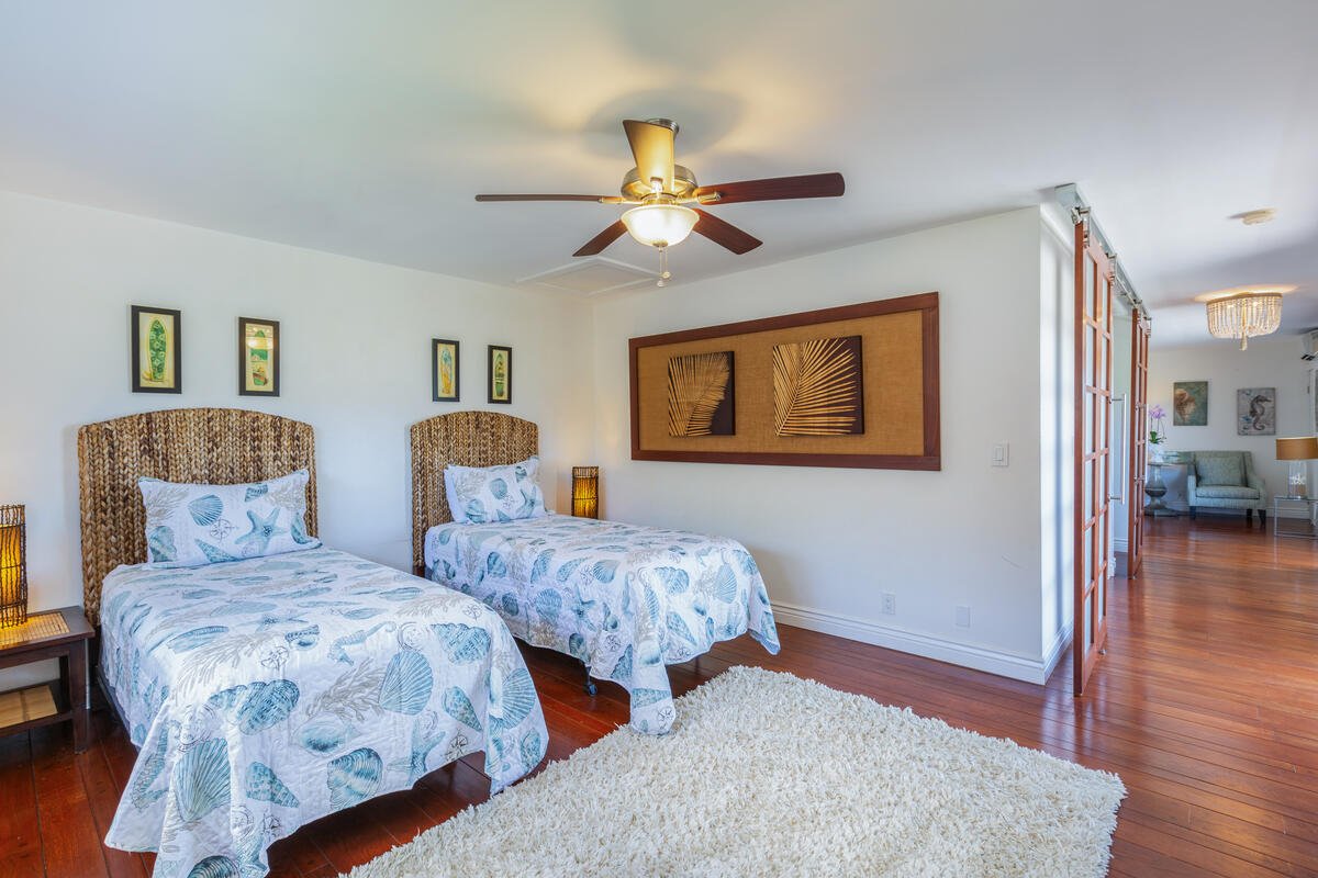 The open upstairs den comes equipped with split air conditioning, providing maximal comfort and flexible sleeping accommodations adjacent to the primary suite.
