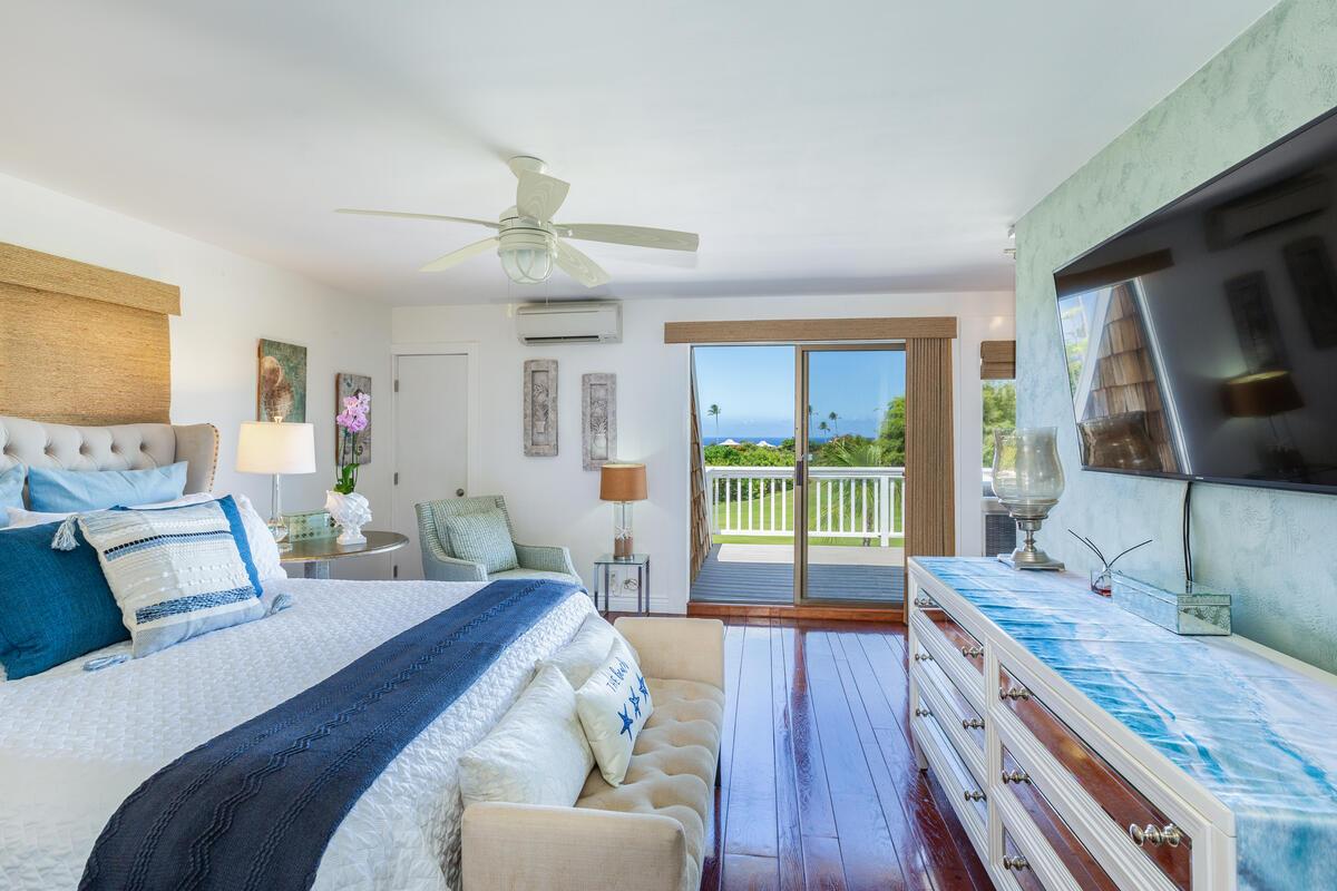 Wake up to tranquil golf course views from the primary suite, complete with private lanai access and a relaxing island ambiance.