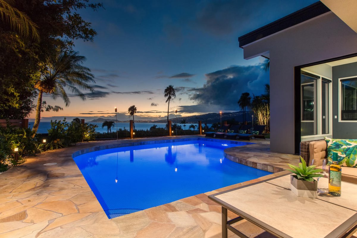 Dusk view of pool lanai at beautiful Aloha Nalu