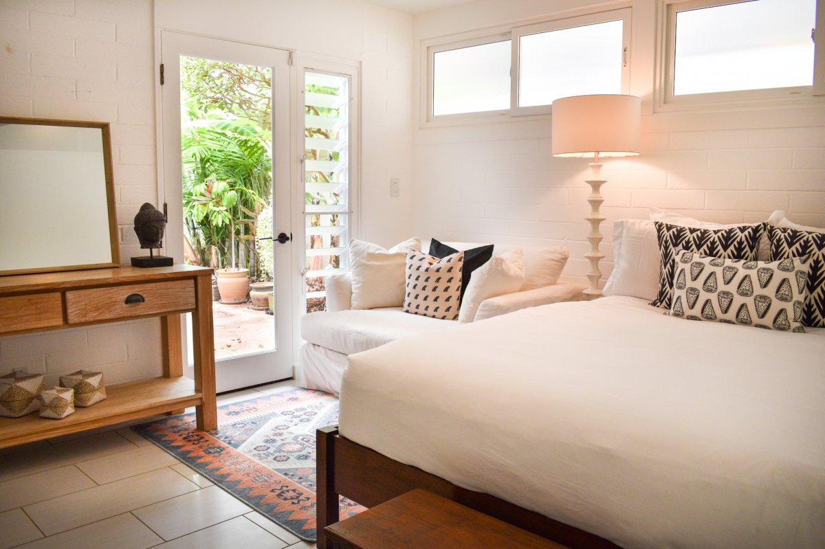 Bedroom Two of Hale Ohana with a queen bed, love seat and garden view