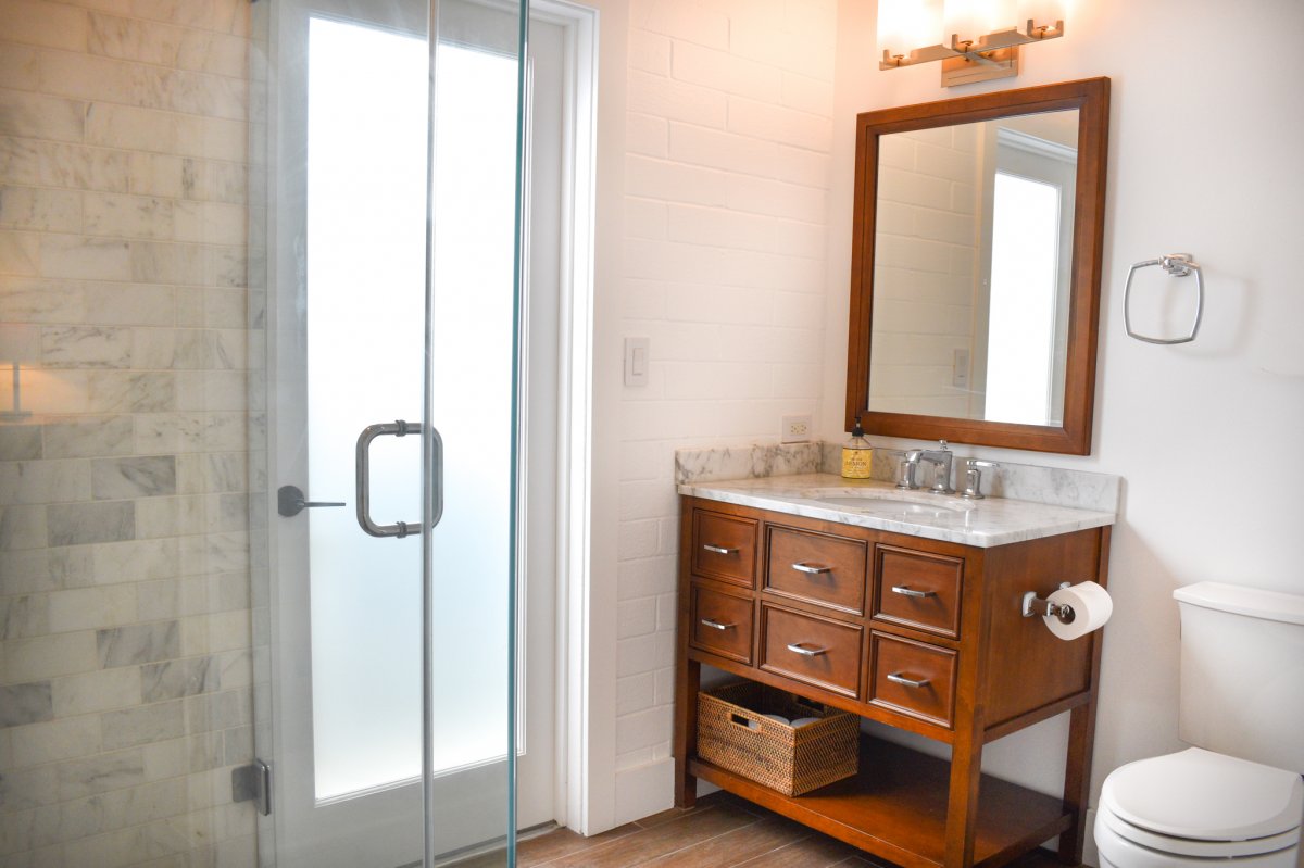 Adjacent Bathroom of Bedroom Four at Hale Ohana with  a spacious walk-in shower, vanity and toilet