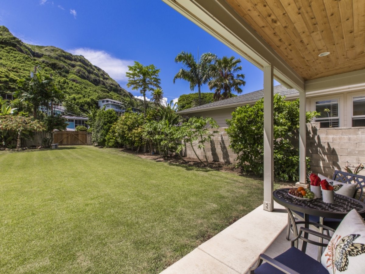 Hale Nani Lanikai's large lawn for lounging or play with the stunning view of the Ka`Iwi ridge line