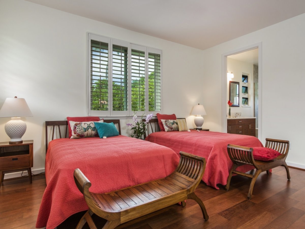 Bedroom Two with two twin beds and benches at the foot of the beds