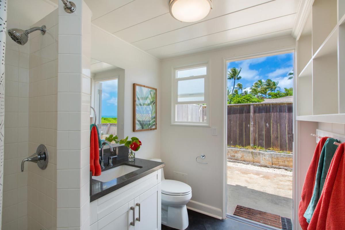 Stylish guest bathroom with updated fixtures and outdoor views—adds convenience and comfort for all.