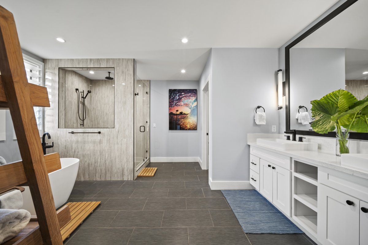 Enjoy a bright, spacious bathroom with dual vanities, modern finishes, and a large walk-in shower.