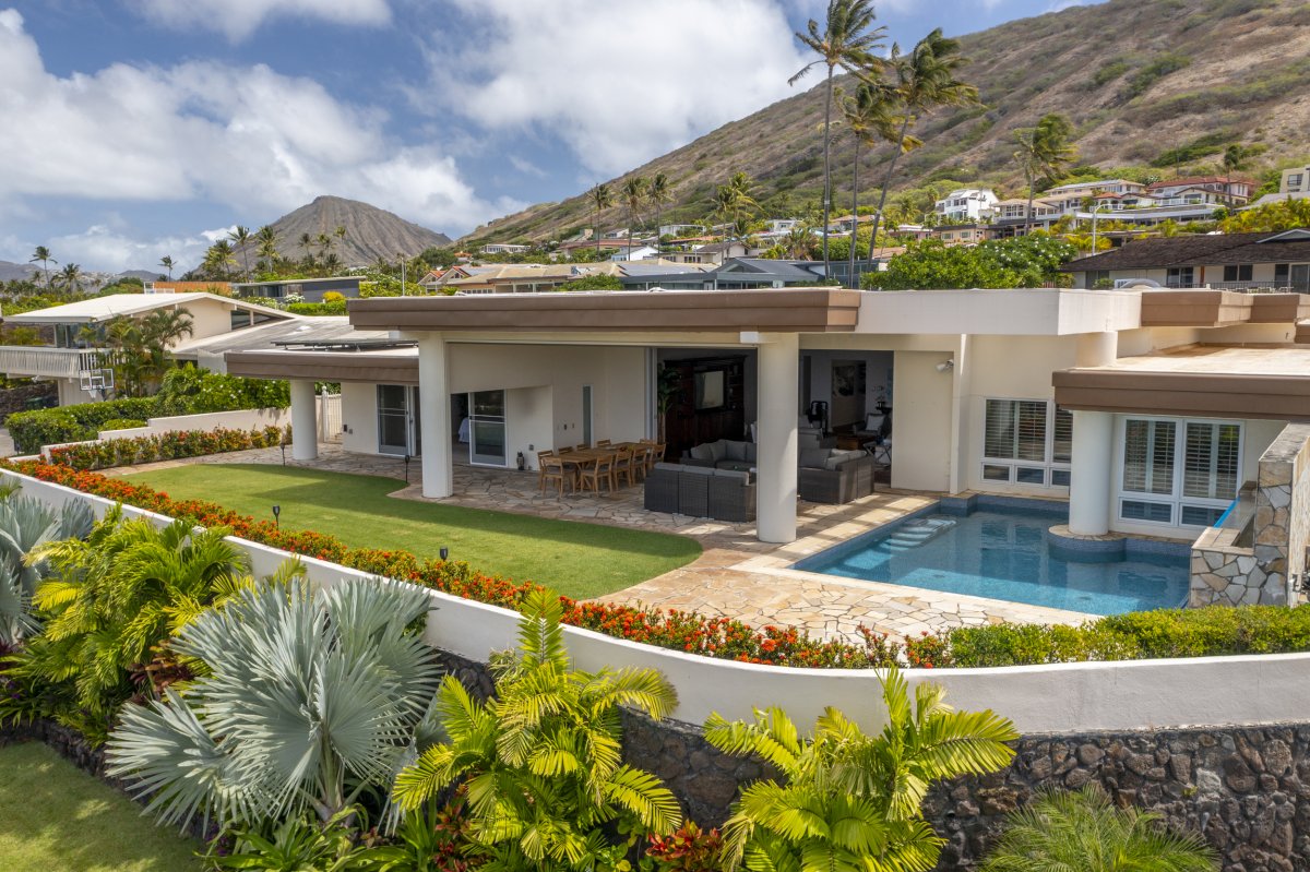 Aerial view of Hale Makana luxury home on Oahu with Diamond Head mountains in the background