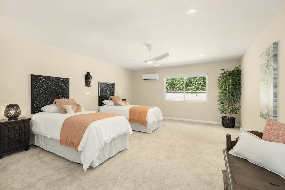 Hale Makana's Bedroom Two with 2 twin beds, air conditioning, and a ceiling fan