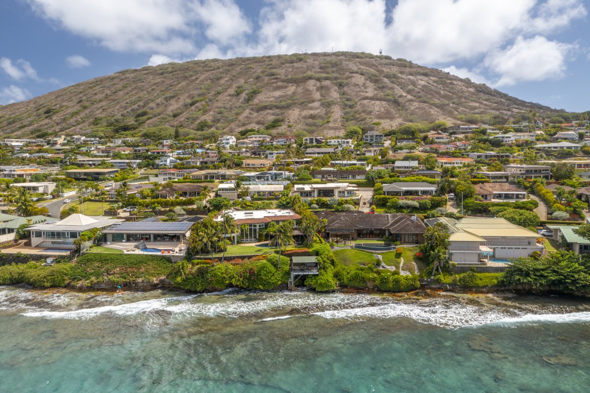 Hale Makana's residential aerial view surrounded by lush, green hills and Diamond Head mountain on Oahu