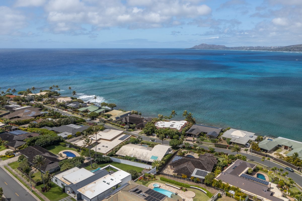 Oahu's residential area aerial view next to the blue ocean