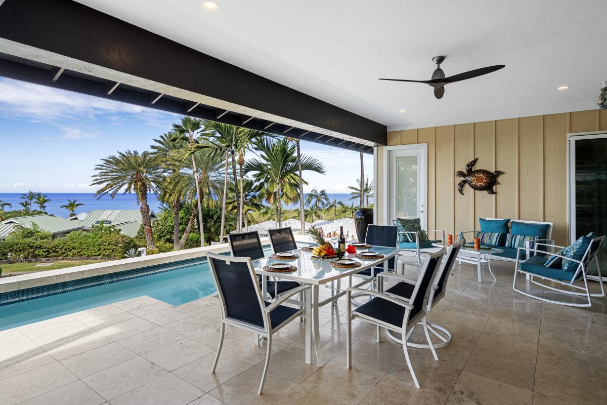 Dine al fresco on the lanai, enjoying the tropical breeze and poolside views.