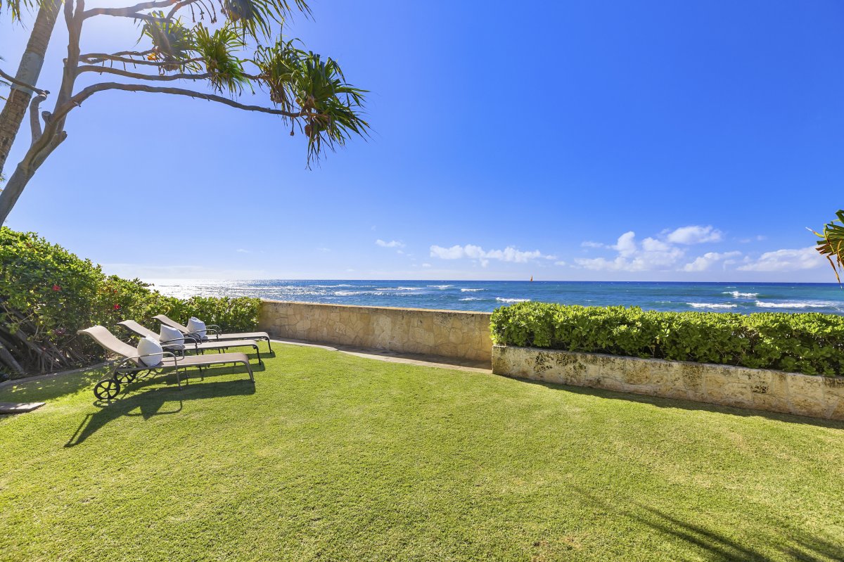 Hale Makai vacation rental home yard with oceanfront view at Diamond Head on Oahu