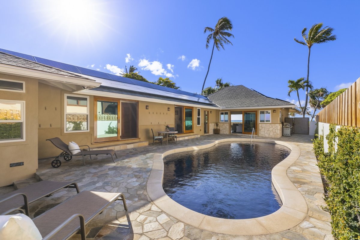 Experience ultimate relaxation at Hale Makai's pool area, complete with comfortable seating and lounge chairs