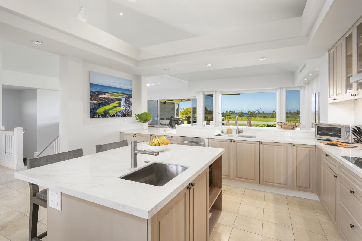 Your spacious kitchen features modern appliances and stunning views through large windows, creating the perfect space for culinary adventures.