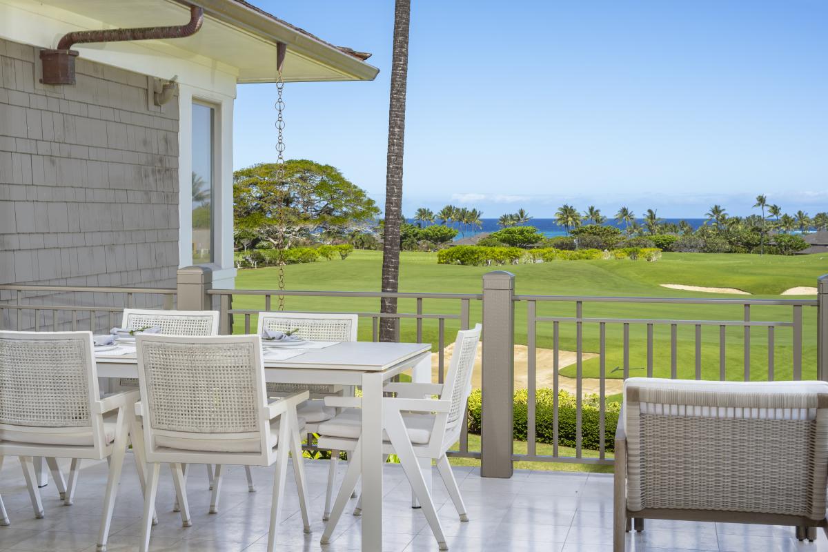 Dine al fresco while enjoying stunning golf course views stretching to the azure ocean beyond.