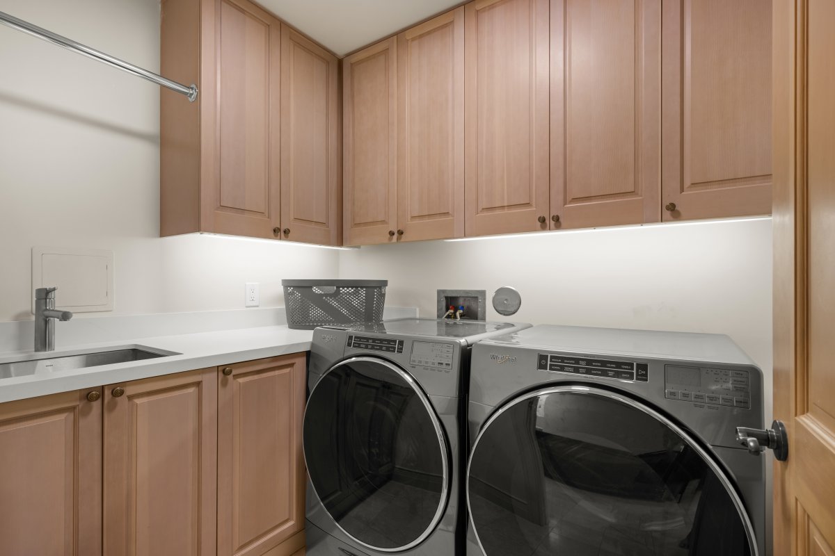 Your private laundry room features modern appliances and ample cabinet storage for all your travel essentials.