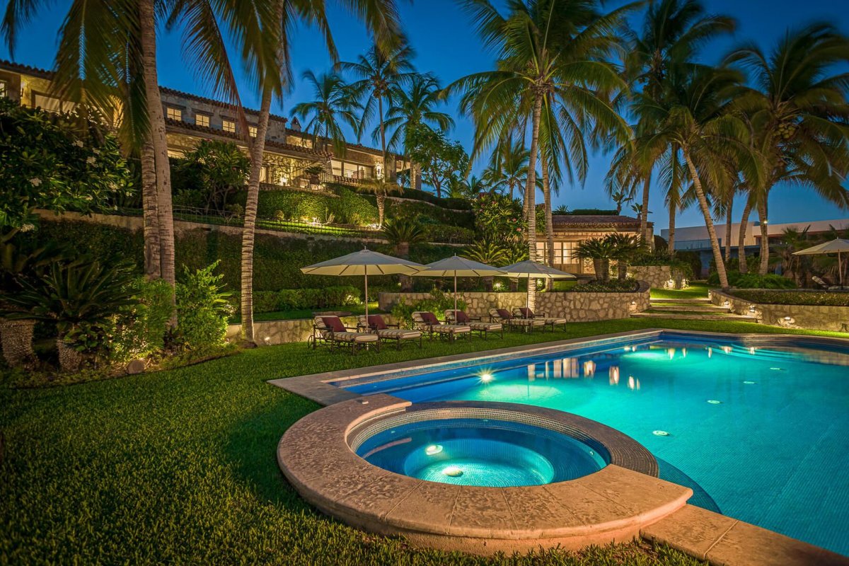 Lounge under the tall palm trees and feel as if you're in a secluded hideaway everywhere in this villa.