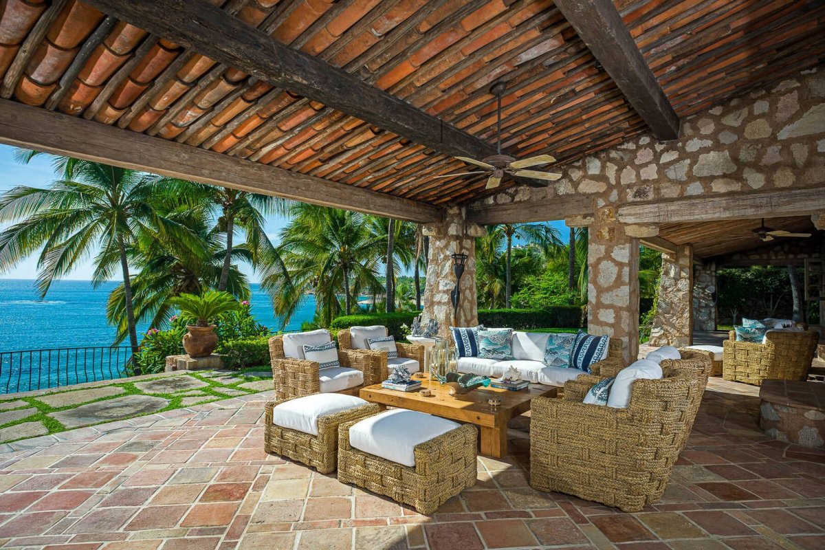 Move indoors to more cozy sofas and unique decor in the villa's open living area.