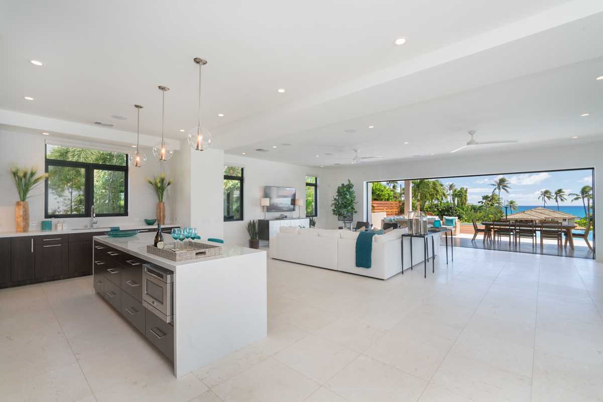 Kitchen counter overlooking the living area, lanai, and ocean view at Diamond Head Grandeur Villa on Oahu