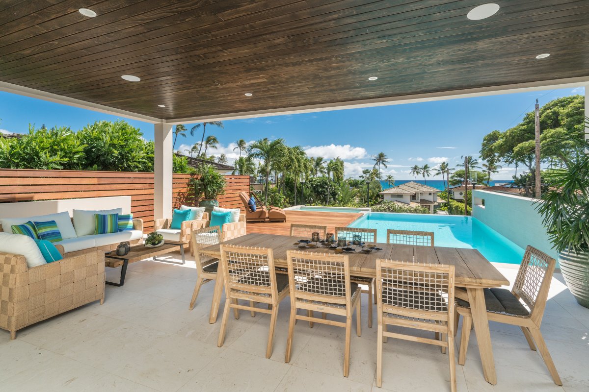 Pool with an attached jacuzzi spa and ocean views from the covered private lanai at Diamond Head Grandeur Villa on Oahu