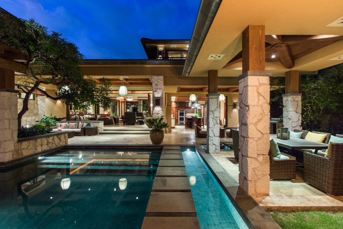 Banyan House Villa with a modern-style swimming pool and a lanai with outdoor resin wicker sofa sets